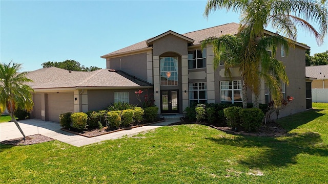 view of front of house featuring french doors, stucco siding, and a front lawn