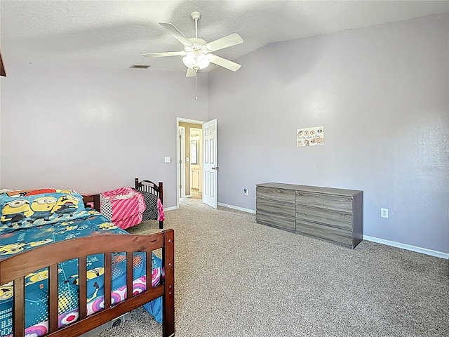 carpeted bedroom with ceiling fan, visible vents, baseboards, and lofted ceiling