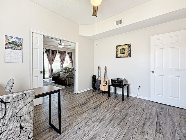 office area featuring visible vents, ceiling fan, wood finished floors, and baseboards