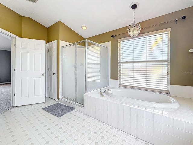 full bath featuring an inviting chandelier, vaulted ceiling, a garden tub, and a stall shower