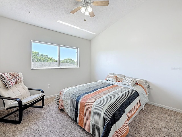 carpeted bedroom with baseboards, a ceiling fan, lofted ceiling, and a textured ceiling