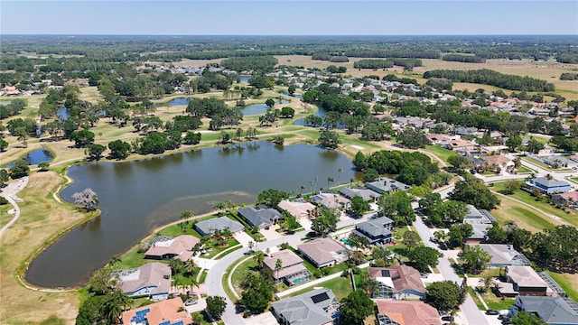 birds eye view of property featuring a water view, view of golf course, and a residential view