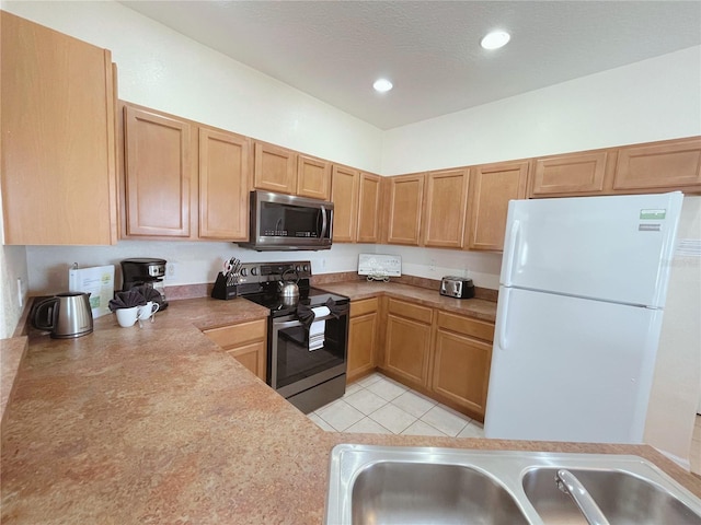 141 Summer Place Loop, Clermont, FL 34714 - kitchen with stainless steel appliances, recessed lighting, light countertops, and light tile patterned floors