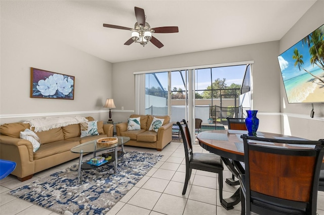 living room featuring light tile patterned floors and ceiling fan