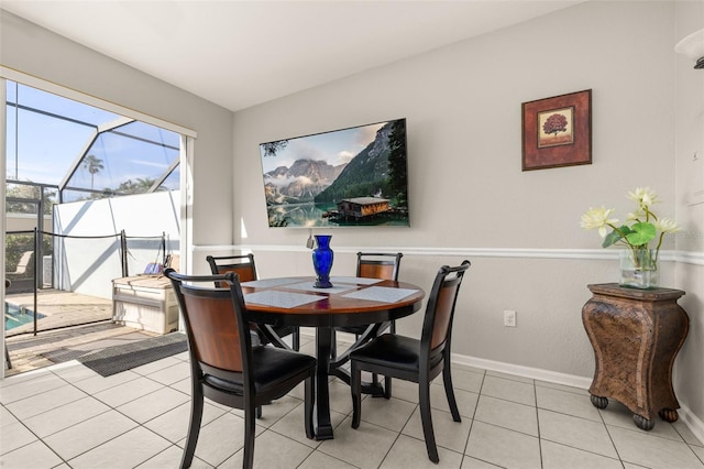 dining area with light tile patterned floors and baseboards