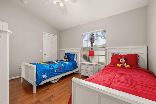 bedroom with lofted ceiling, wood finished floors, and a ceiling fan