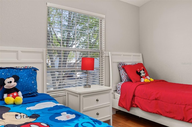bedroom featuring wood finished floors