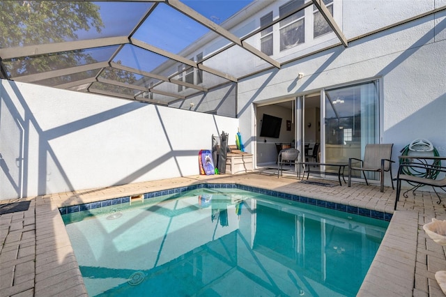 outdoor pool featuring a patio and a lanai