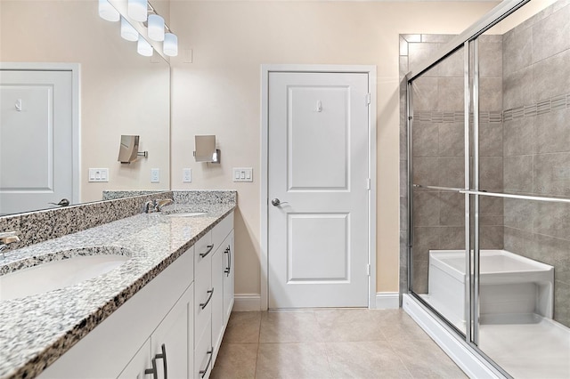 7505 Laureate Blvd Unit 2208, Orlando, FL 32827 - bathroom with tile patterned flooring, a stall shower, and a sink