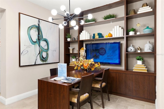7505 Laureate Blvd Unit 2208, Orlando, FL 32827 - dining room with a chandelier, baseboards, and tile patterned flooring