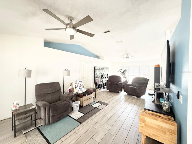6922 Doehring Dr, Lakeland, FL 33810 - living room featuring visible vents, a ceiling fan, light wood finished floors, and lofted ceiling