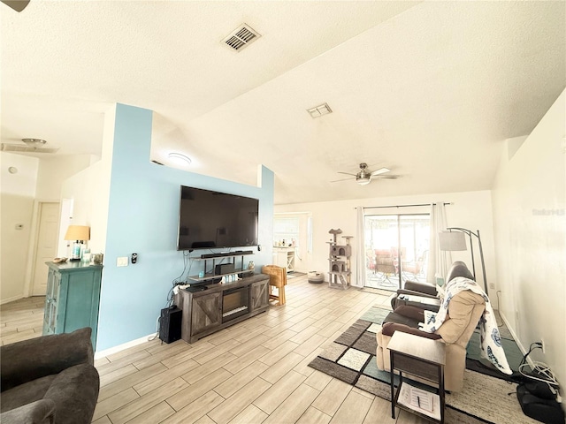 6922 Doehring Dr, Lakeland, FL 33810 - living room featuring a ceiling fan, wood finish floors, visible vents, and lofted ceiling
