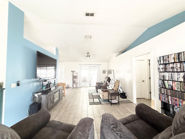 6922 Doehring Dr, Lakeland, FL 33810 - living area with light wood-style floors, a ceiling fan, lofted ceiling, and visible vents