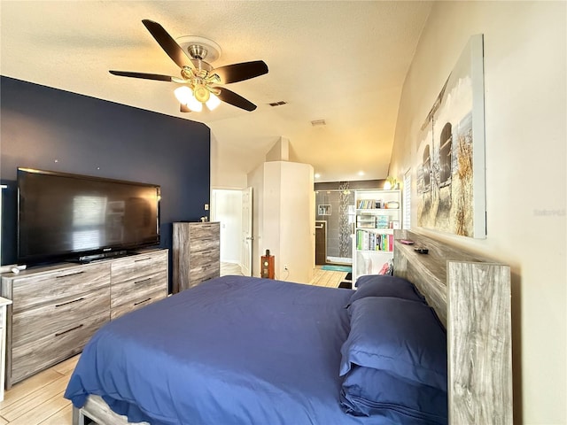 6922 Doehring Dr, Lakeland, FL 33810 - bedroom featuring a ceiling fan, visible vents, lofted ceiling, and light wood-type flooring