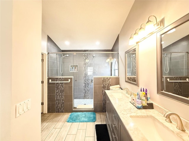 6922 Doehring Dr, Lakeland, FL 33810 - full bath featuring double vanity, wood finish floors, a shower stall, and a sink