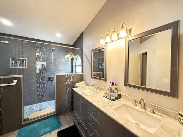6922 Doehring Dr, Lakeland, FL 33810 - full bath featuring double vanity, a sink, a textured ceiling, and a stall shower