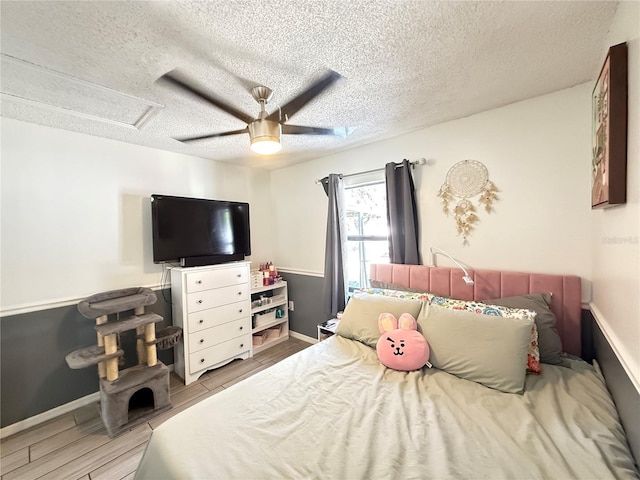 6922 Doehring Dr, Lakeland, FL 33810 - bedroom featuring a textured ceiling, ceiling fan, baseboards, and wood finished floors