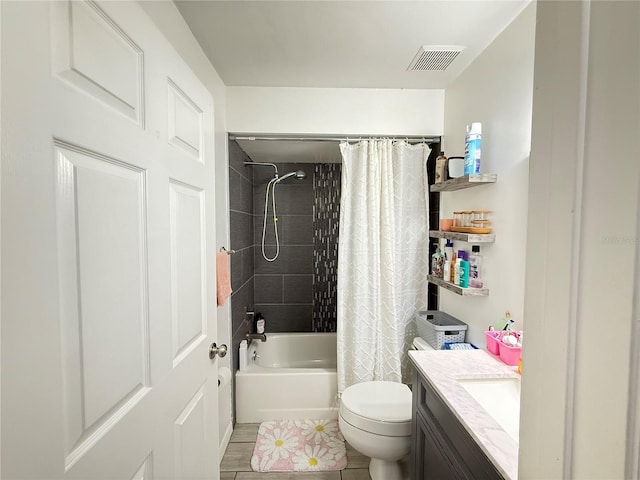 6922 Doehring Dr, Lakeland, FL 33810 - bathroom with vanity, toilet, tile patterned floors, shower / bathtub combination with curtain, and visible vents