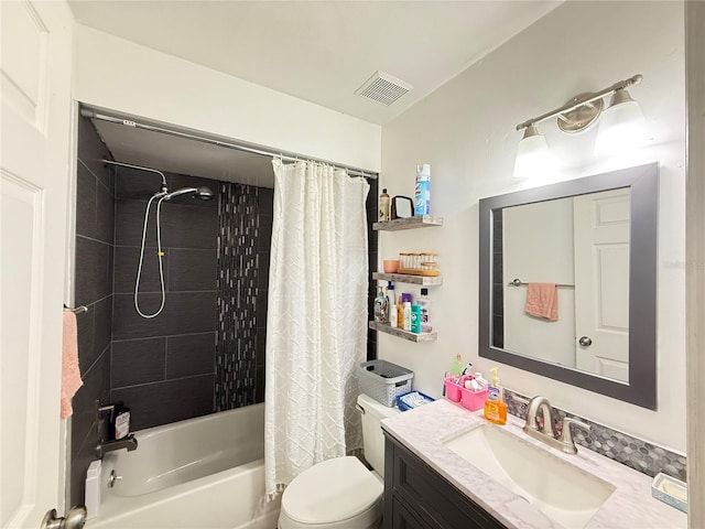 6922 Doehring Dr, Lakeland, FL 33810 - bathroom featuring vanity, toilet, visible vents, and shower / tub combo with curtain