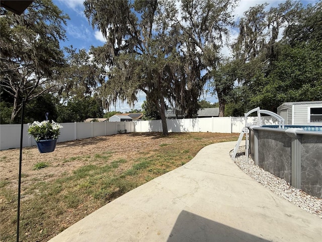 6922 Doehring Dr, Lakeland, FL 33810 - view of yard featuring a fenced in pool, a patio area, and fence