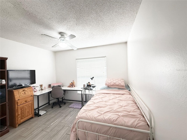 6922 Doehring Dr, Lakeland, FL 33810 - bedroom with a ceiling fan, light wood-type flooring, and a textured ceiling