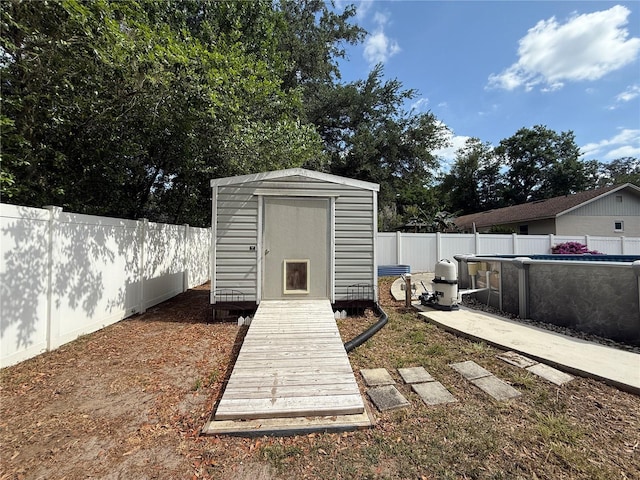 6922 Doehring Dr, Lakeland, FL 33810 - view of shed with a fenced in pool and a fenced backyard