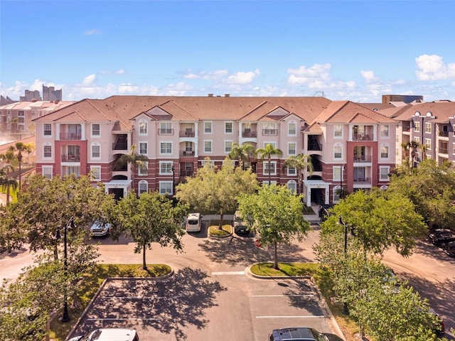 4862 Cayview Ave Unit 407, Orlando, FL 32819 - view of building exterior featuring a residential view and uncovered parking