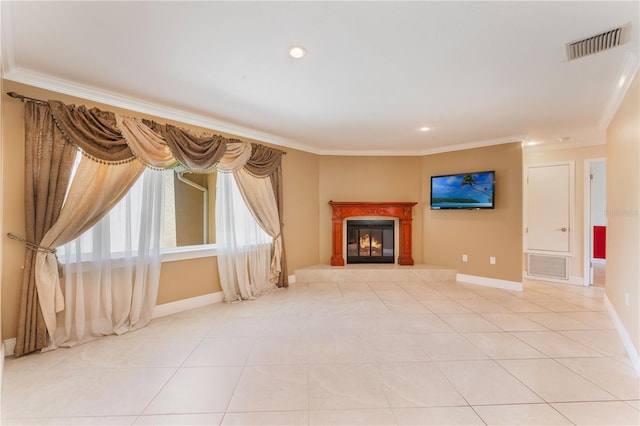 unfurnished living room with ornamental molding, visible vents, and a tiled fireplace