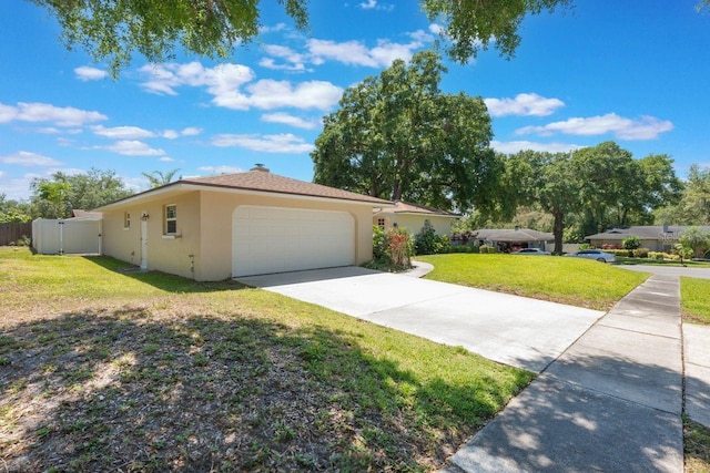 580 S Indigo Rd, Altamonte Springs, FL 32714 - single story home with stucco siding, a garage, and concrete driveway