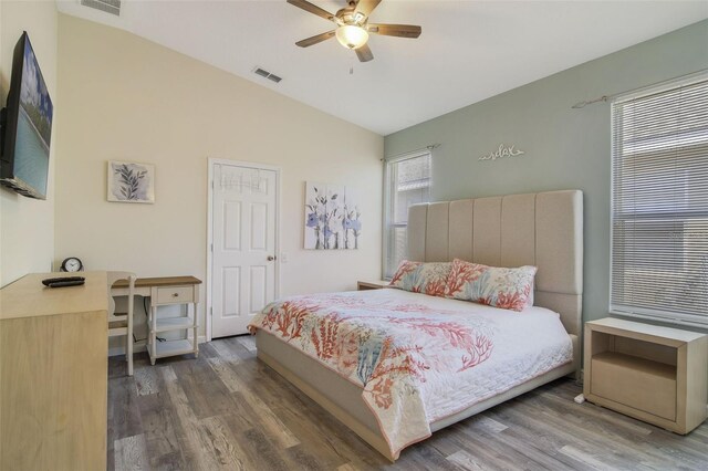 2237 Wyndham Palms Way, Kissimmee, FL 34747 - bedroom with visible vents, ceiling fan, wood finished floors, and lofted ceiling