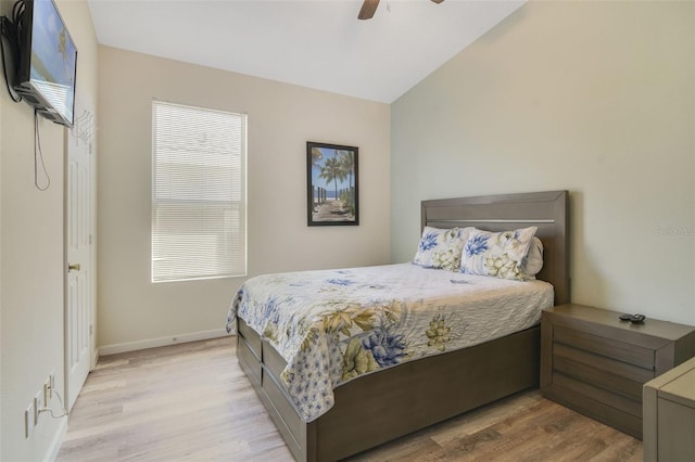 2237 Wyndham Palms Way, Kissimmee, FL 34747 - bedroom featuring lofted ceiling, baseboards, a ceiling fan, and wood finished floors