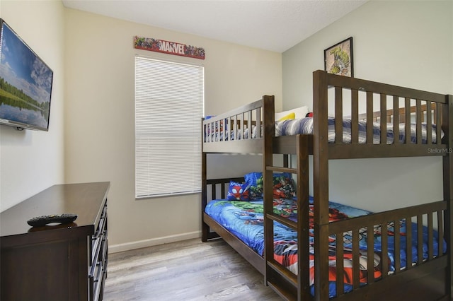 2237 Wyndham Palms Way, Kissimmee, FL 34747 - bedroom with baseboards and wood finished floors