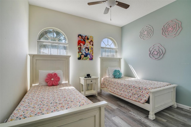 2237 Wyndham Palms Way, Kissimmee, FL 34747 - bedroom with wood finished floors and ceiling fan