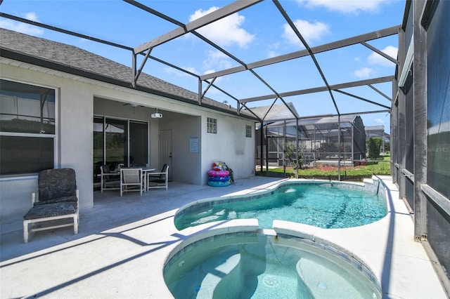 2237 Wyndham Palms Way, Kissimmee, FL 34747 - view of swimming pool with ceiling fan, a pool with connected hot tub, outdoor dining space, a patio, and a lanai