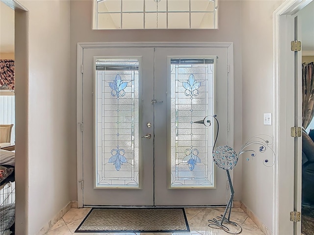 106 Meridian St, Davenport, FL 33837 - foyer entrance featuring baseboards and french doors