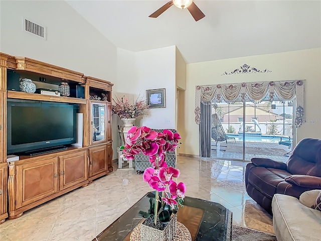 106 Meridian St, Davenport, FL 33837 - living room featuring lofted ceiling, visible vents, a ceiling fan, and light tile patterned floors
