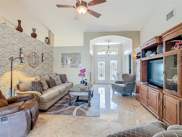 106 Meridian St, Davenport, FL 33837 - living room with marble finish floor, arched walkways, a ceiling fan, and visible vents