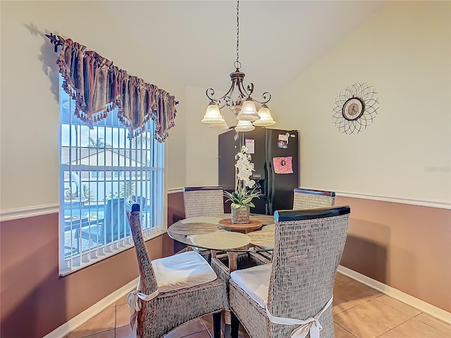 106 Meridian St, Davenport, FL 33837 - dining room with baseboards, tile patterned flooring, and a chandelier