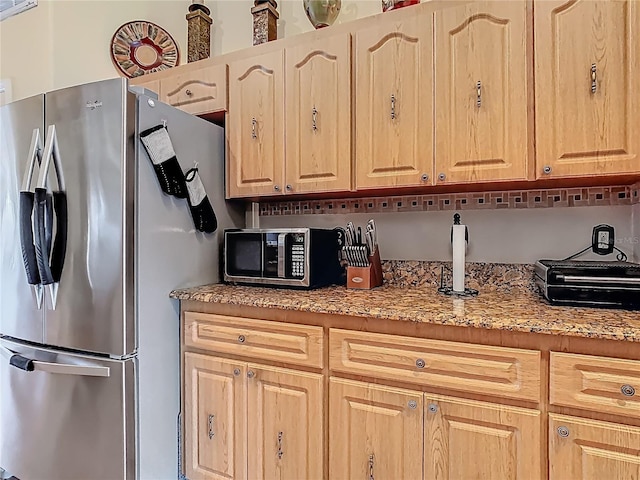 106 Meridian St, Davenport, FL 33837 - kitchen with appliances with stainless steel finishes and light brown cabinetry