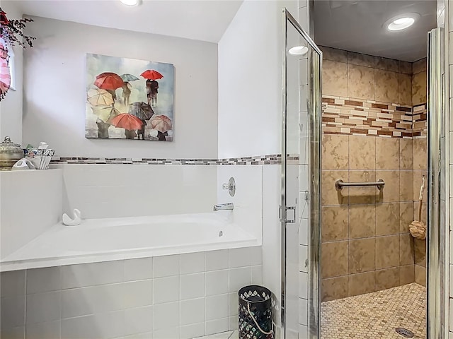 106 Meridian St, Davenport, FL 33837 - full bathroom with a garden tub, recessed lighting, and a shower stall