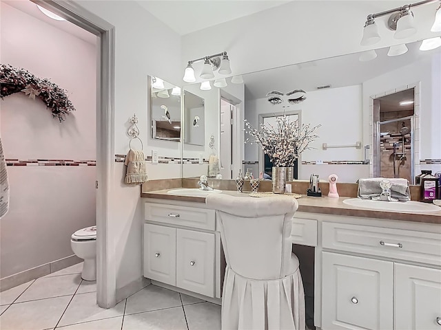 106 Meridian St, Davenport, FL 33837 - bathroom featuring a shower with shower door, tile patterned floors, vanity, and toilet