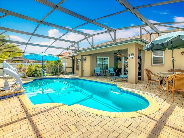 106 Meridian St, Davenport, FL 33837 - outdoor pool with glass enclosure, a ceiling fan, a water slide, and a patio