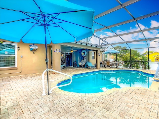 106 Meridian St, Davenport, FL 33837 - pool featuring outdoor dining area, glass enclosure, and a patio