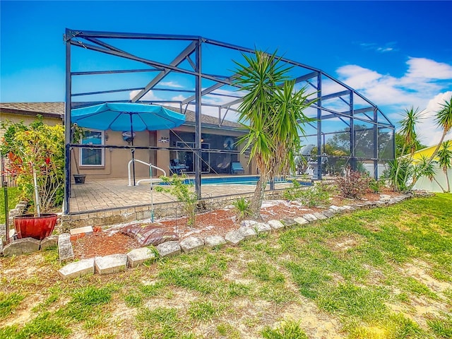 106 Meridian St, Davenport, FL 33837 - outdoor pool with glass enclosure and a patio area