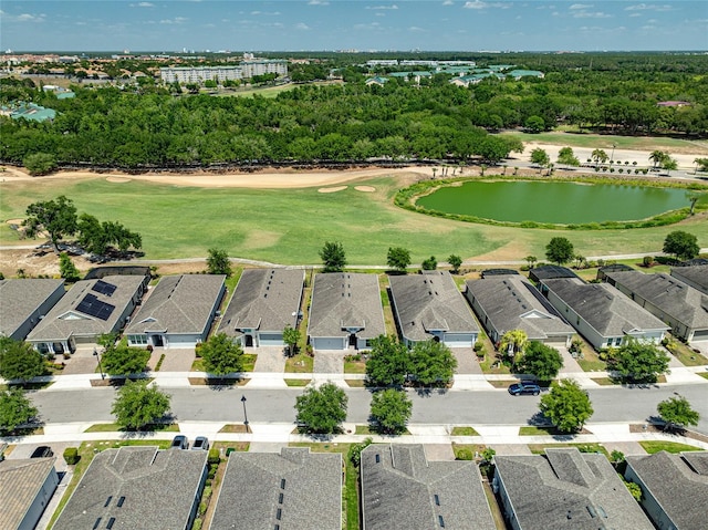 7957 Hanson Bay Pl, Kissimmee, FL 34747 - birds eye view of property with golf course view, a water view, and a residential view
