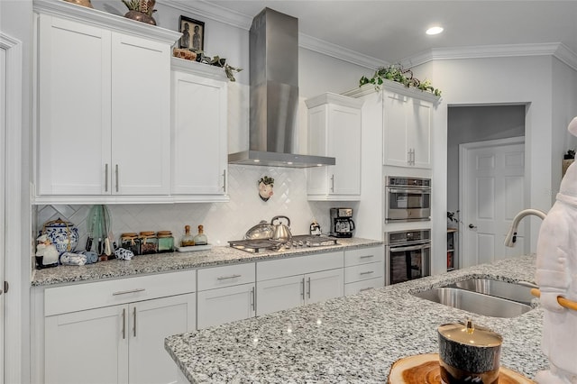 7957 Hanson Bay Pl, Kissimmee, FL 34747 - kitchen with a sink, crown molding, wall chimney exhaust hood, backsplash, and white cabinetry