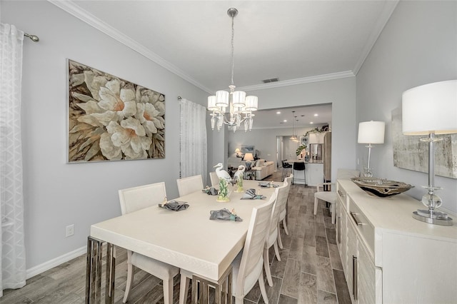 7957 Hanson Bay Pl, Kissimmee, FL 34747 - dining space featuring ornamental molding, light wood finished floors, visible vents, and a chandelier