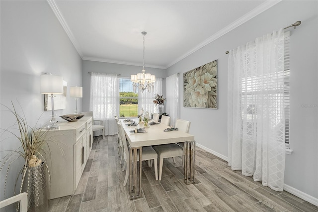 7957 Hanson Bay Pl, Kissimmee, FL 34747 - dining area with ornamental molding, wood finish floors, a notable chandelier, and baseboards