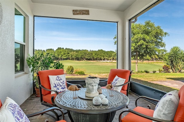 7957 Hanson Bay Pl, Kissimmee, FL 34747 - sunroom / solarium featuring view of golf course