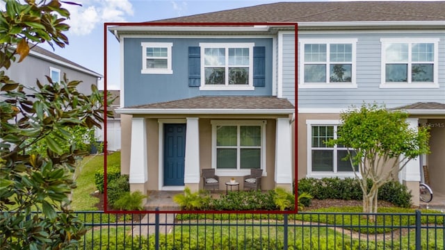 11162 Hanlon Terrace Aly, Winter Garden, FL 34787 - view of front of property with stucco siding, covered porch, fence private yard, and roof with shingles